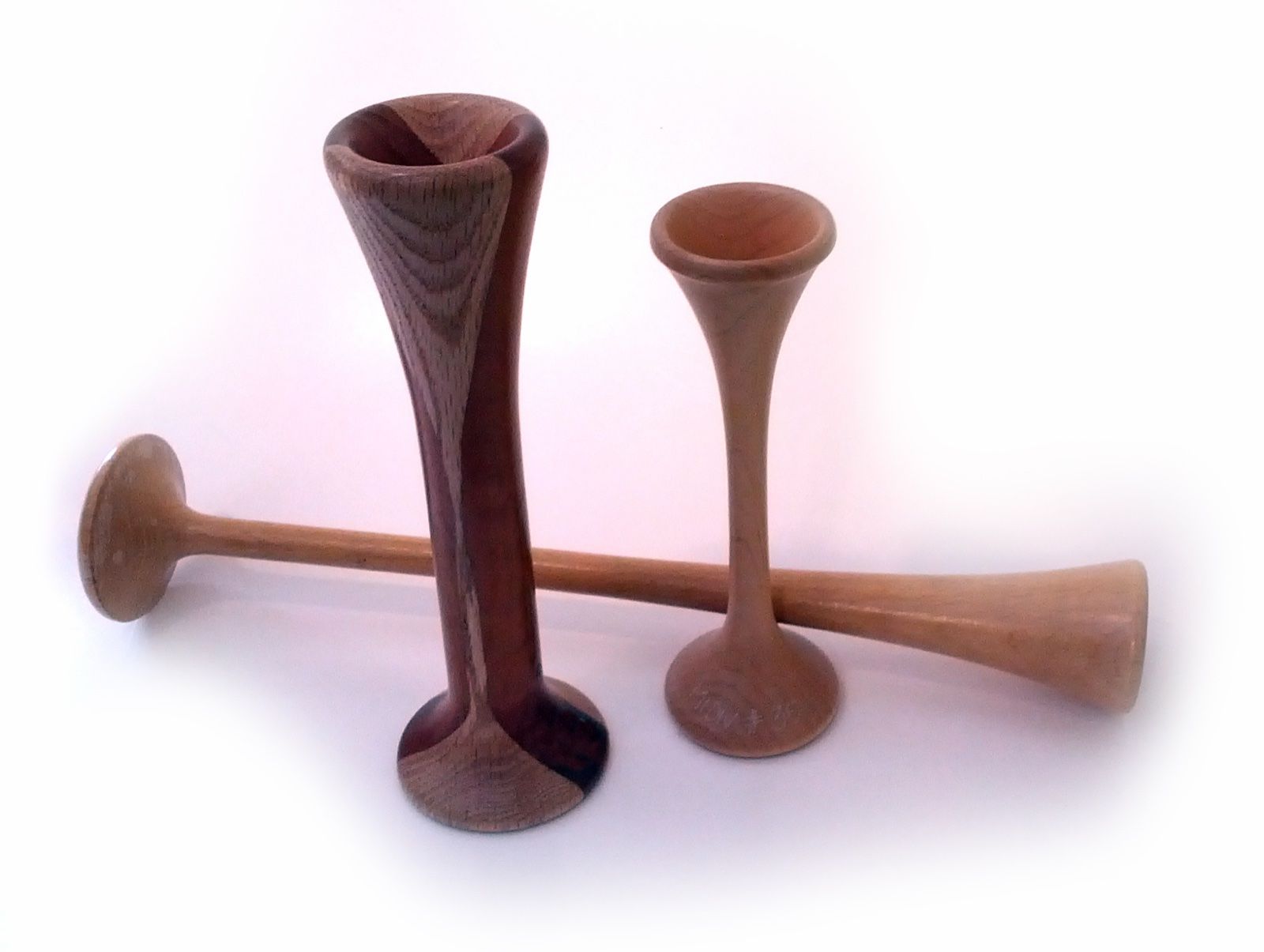 A trio of turned wooden Pinard horns used by midwives to listen to the fetal heart, a Wikimedia Commons photograph in the encyclopedia of Candace Cooley